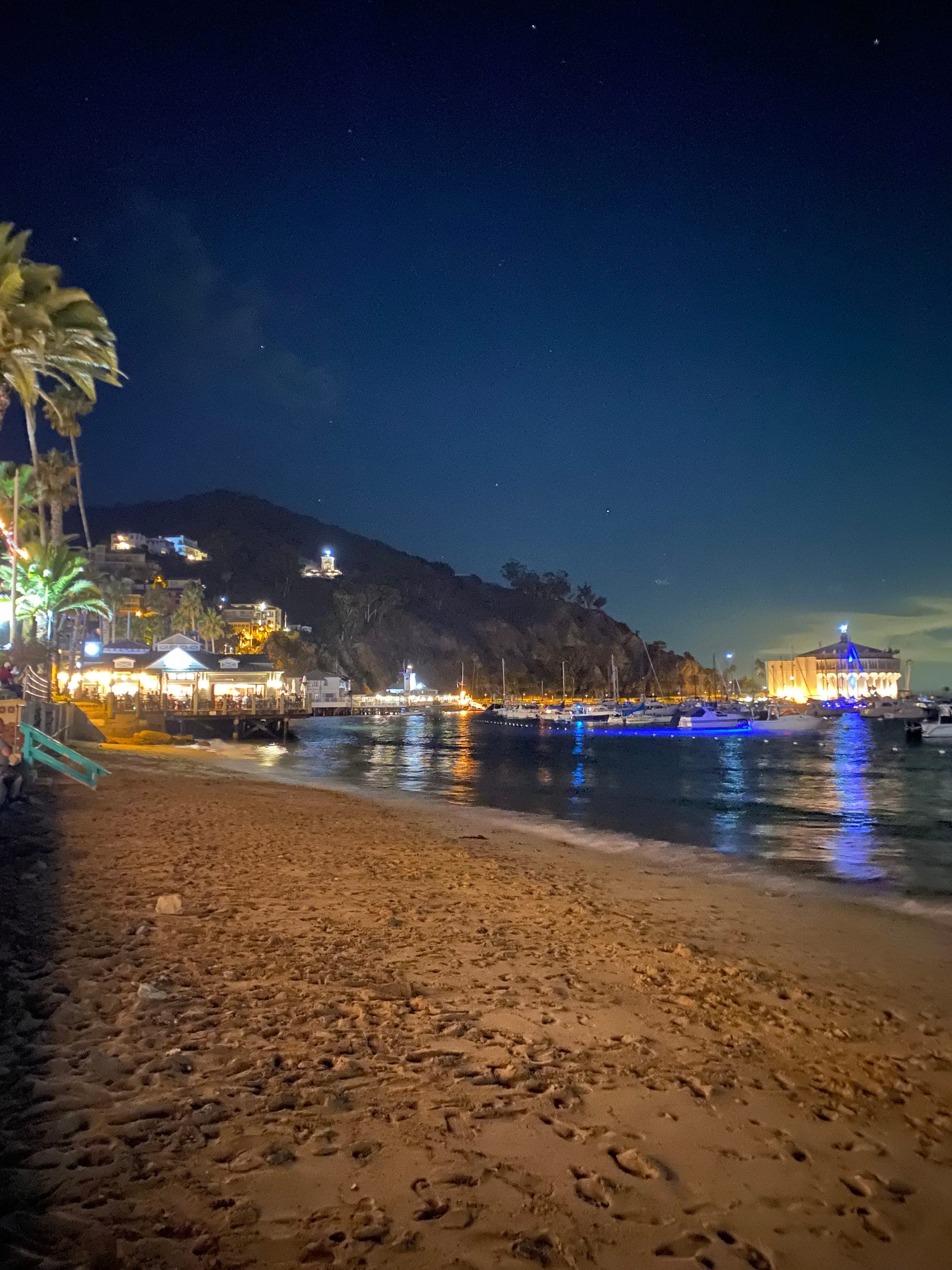 The Casino lit up at night across the beach