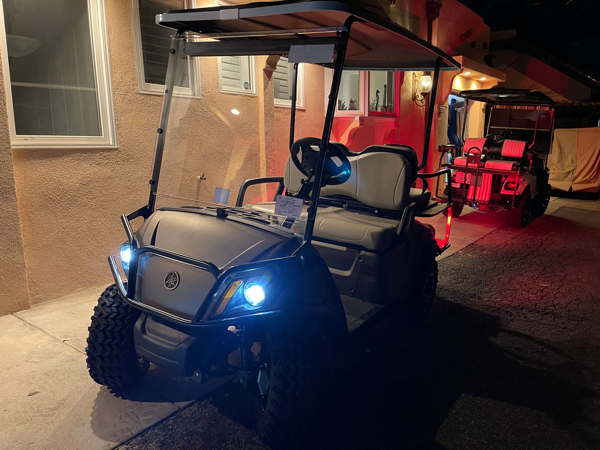 A rental golf cart parked in Avalon at night